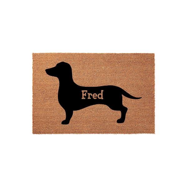 Personalized Dachshund doormat featuring a black silhouette of a long-bodied dog on a natural coir fiber background, showcasing a customizable area for a name to welcome guests to your home with a charming pet-themed entryway