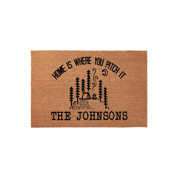 Personalized Camping Doormat featuring a rustic forest, tent, and campfire design with the text Home Is Where You Pitch It, set against a natural coir fiber background that adds a welcoming touch to any outdoor entryway or porch