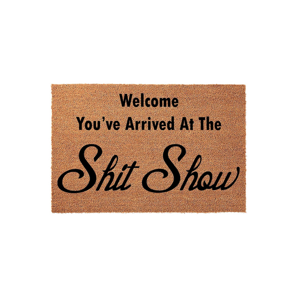 Funny Welcome Doormat featuring a natural coir texture with bold black text that reads Welcome You've Arrived At The Shit Show, making this humorous outdoor floor mat a cheeky addition to any front porch or entryway decor for