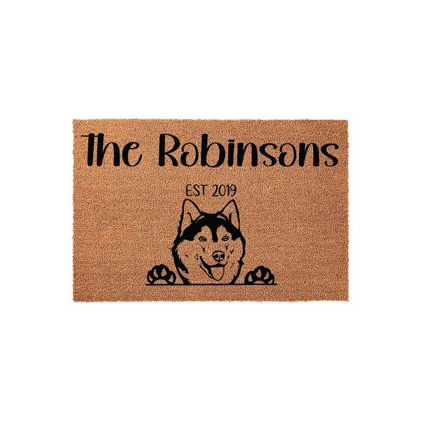 Personalized Husky dog doormat featuring a cute illustration of a Siberian Husky peeking over the edge with its paws, customized with a family name and established year on a natural coir fiber background for a welcoming home
