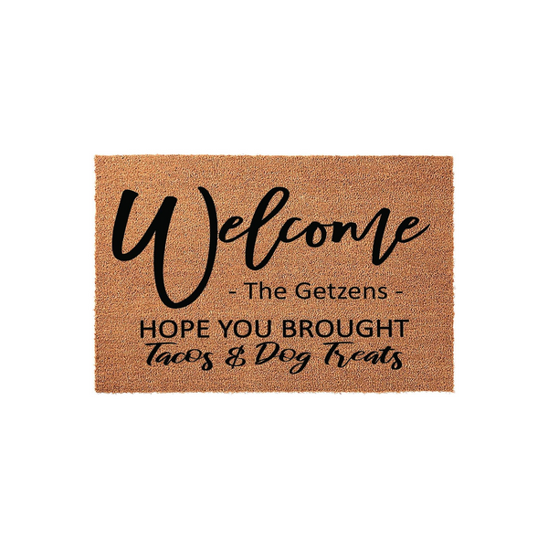 Personalized Welcome Doormat featuring a natural coir texture with black text that reads Welcome, a space for a family name, and the humorous phrase Hope You Brought Tacos and Dog Treats for a fun entryway decor addition to your