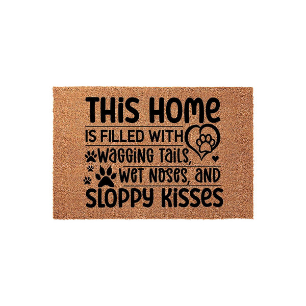 Dog Lover Coir Doormat featuring the text This Home Is Filled With Wagging Tails, Wet Noses, And Sloppy Kisses in black lettering, accented with paw prints and a heart icon on a natural brown textured fiber background for a pet
