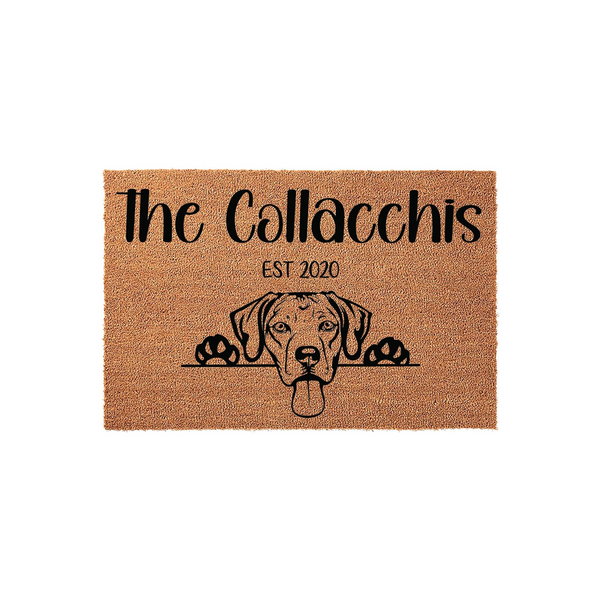 Personalized Dog Breed Doormat featuring a cute Labrador Retriever peeking over a line with custom family name text and established year, printed in black ink on a natural tan coir fiber mat against a clean white studio