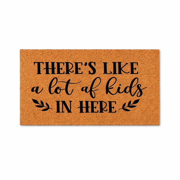 Funny Kids Welcome Doormat featuring a natural coir texture with bold black text that reads There is like a lot of kids in here, accented by simple leaf illustrations on a clean white background for a humorous home entryway decor