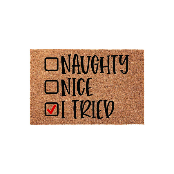 Funny Christmas doormat featuring a checklist with Naughty, Nice, and I Tried options, where a red checkmark is placed next to I Tried on this natural coir fiber mat that adds a humorous holiday touch to any front porch entryway.