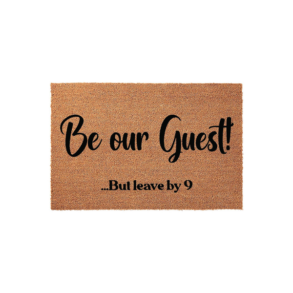 Funny Be Our Guest But Leave By 9 coir doormat featuring bold black script and serif typography on a natural brown textured fiber background, perfect for adding a humorous touch to your front porch entryway decor.