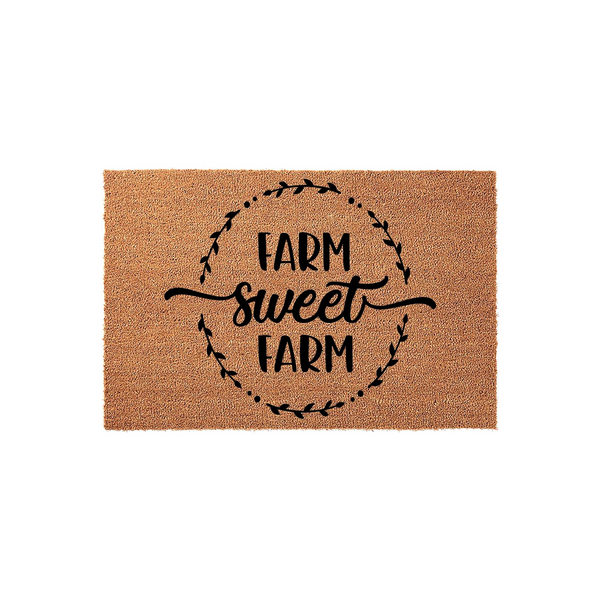 Farm Sweet Farm coir doormat featuring a rustic farmhouse aesthetic with black text and a decorative leaf wreath design printed on a natural brown coconut fiber mat, perfect for a welcoming front porch or entryway decor.