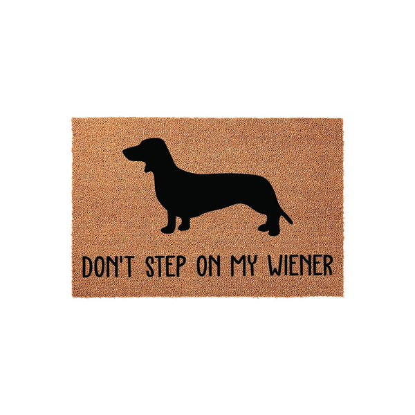 Dachshund Wiener Dog Coir Doormat featuring a black silhouette of a long-bodied dog on a natural brown textured background with the humorous text Don't Step On My Wiener printed in a clean, modern sans-serif font for a fun