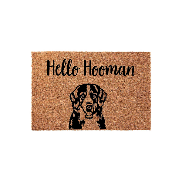 Bernese Mountain Dog Hello Hooman coir doormat featuring a black and brown dog illustration on a natural fiber background, providing a welcoming and humorous entrance decor piece for any dog lover's home front porch or entryway.