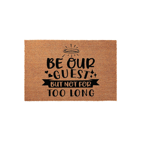 Funny Be Our Guest But Not For Too Long coir doormat featuring a natural brown fiber texture and bold black typography, designed as a humorous welcome mat for a front porch or entryway to greet visitors with a playful and witty