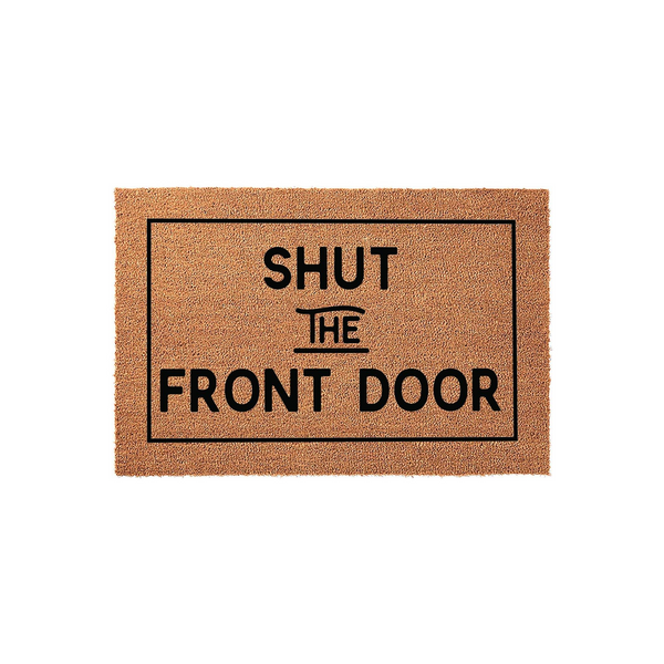 Shut the Front Door funny doormat featuring a natural coir texture and a bold black rectangular border, displaying the humorous phrase in a clean, modern sans-serif font against the rustic brown background for a welcoming
