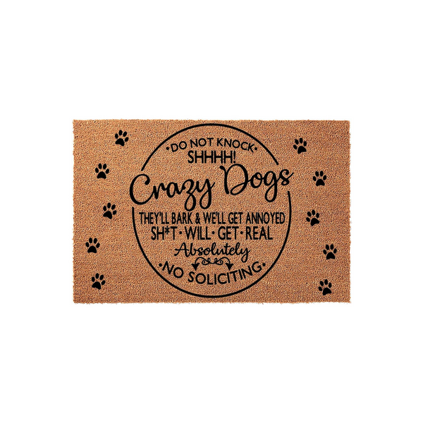Funny Crazy Dogs doormat featuring a natural coir texture with black paw prints and bold text that reads Do Not Knock Shhhh Crazy Dogs, warning visitors that they will bark and there is absolutely no soliciting allowed at the