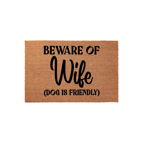 Beware of Wife Dog Is Friendly doormat made of natural coir fibers with a humorous black printed message, featuring a funny quote that makes a great entryway floor mat for any home with a dog and a sense of humor about family