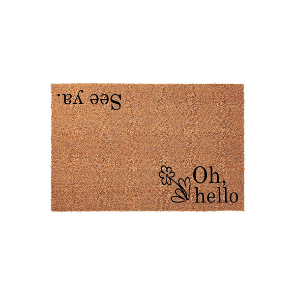 Oh hello see ya coir doormat featuring a natural brown fiber texture with black printed text that reads Oh hello on one side and See ya on the other, creating a fun and welcoming entryway decor piece for your front porch or home