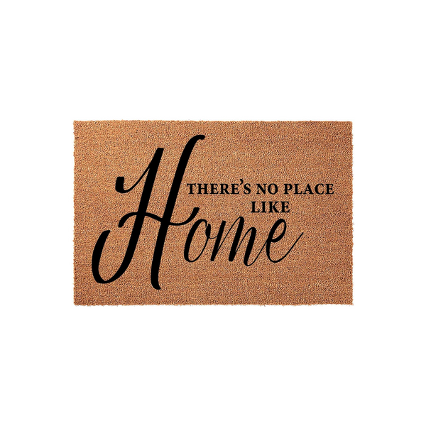 There's No Place Like Home coir doormat featuring a natural brown fiber texture and elegant black script lettering, providing a welcoming and rustic touch to any front porch or entryway decor for a cozy housewarming aesthetic.