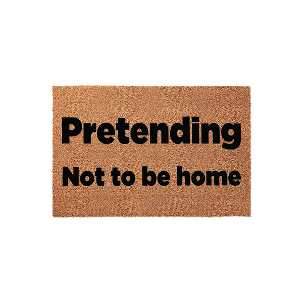 Funny Pretending Not to be Home doormat made of natural coir fiber with bold black text, centered on a plain white background for a clean look that adds a humorous touch to any front porch or entryway decor for your house.
