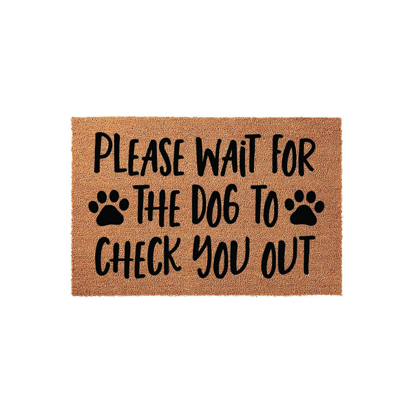Dog Lover Welcome Doormat featuring a natural coir texture with bold black text that reads Please Wait For The Dog To Check You Out, accented by two paw prints on a simple white background for a fun and functional home entryway