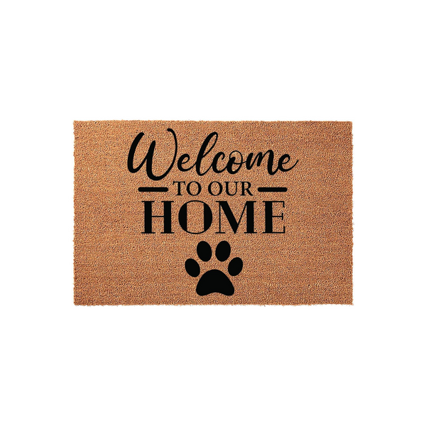 Welcome to Our Home coir doormat featuring a black paw print design, perfect for pet lovers who want to add a touch of rustic charm to their front porch entryway while keeping their home clean and inviting for all guests.