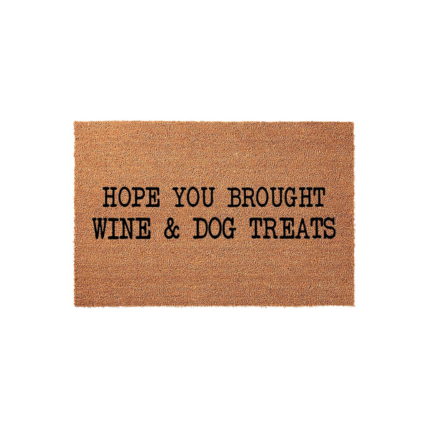 Funny Hope You Brought Wine and Dog Treats doormat made of natural coir fibers, featuring bold black text centered on a rectangular brown mat that adds a humorous and welcoming touch to any front porch or entryway decor.