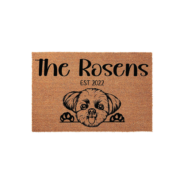 Personalized Shih Tzu dog doormat featuring a cute illustrated puppy peeking over the edge, customized with a family name and established year on a natural coir fiber background for a welcoming front porch entrance decor.