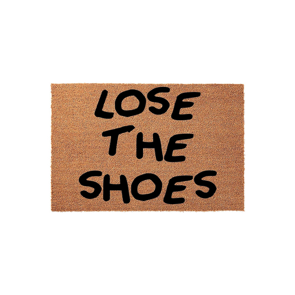 Lose The Shoes coir doormat featuring a natural brown fiber texture and bold black lettering that creates a humorous and functional entryway accent for any home, displayed against a clean white studio background.