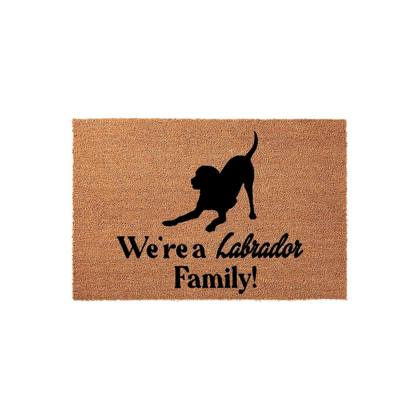 Labrador Retriever family doormat featuring a natural coir texture and a black silhouette of a playful dog, with the text We are a Labrador Family printed in a bold, dark font across the center of this durable outdoor welcome mat.