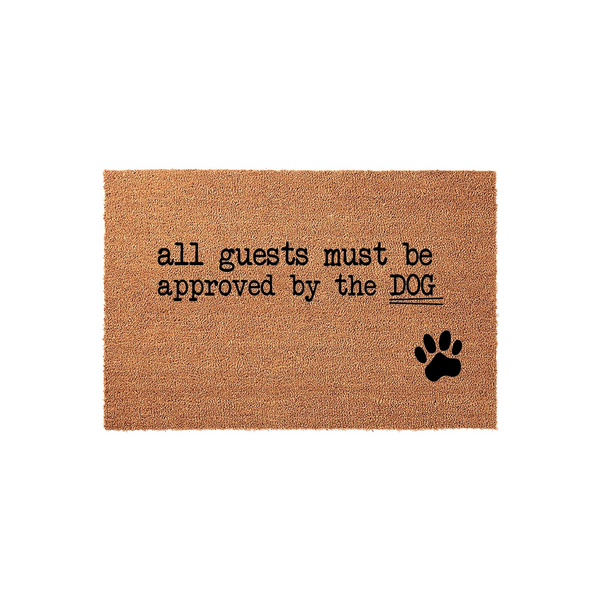 Funny Dog Lover Doormat featuring a natural coir texture with the text all guests must be approved by the DOG and a black paw print graphic, making it a charming addition to any pet owner's front porch or entryway decor.
