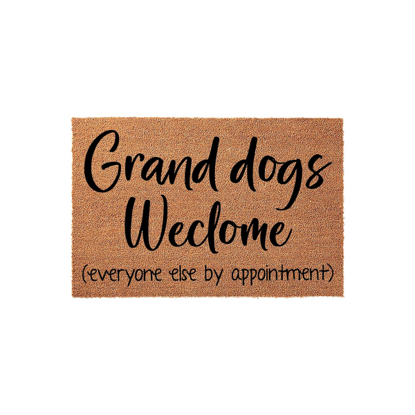 Grand dogs welcome doormat made of natural coir fiber, featuring black script text that reads Grand dogs welcome and everyone else by appointment, set against a clean white background for a humorous entryway decor statement.