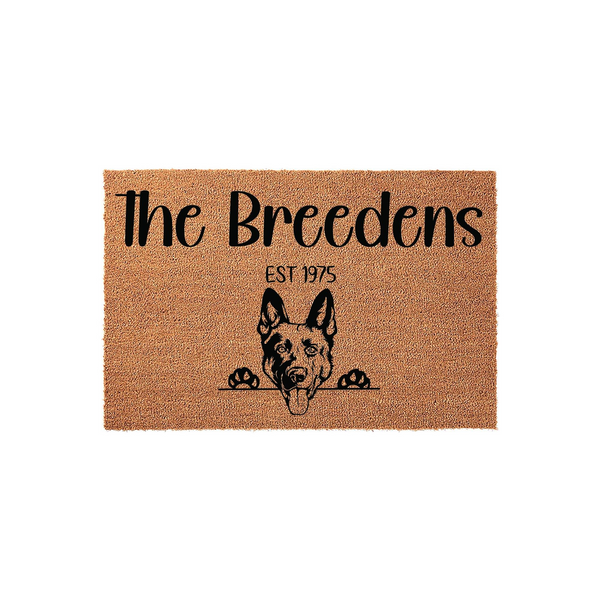 Personalized German Shepherd coir doormat featuring a cute dog peeking over the edge, customized with a family name and established year printed in black ink against the natural brown textured fiber background for a welcoming