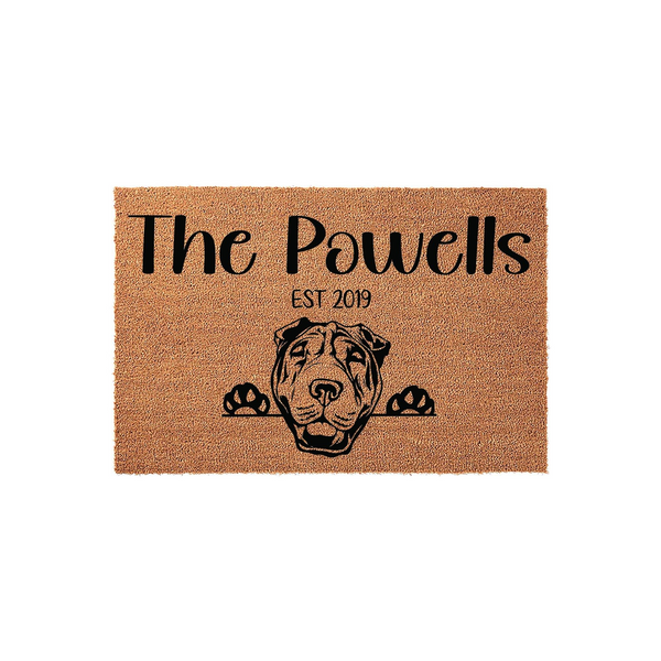 Personalized Shar Pei dog doormat featuring a custom family name and established year printed in black on a natural coir fiber mat, showcasing a cute dog peeking over the bottom edge for a welcoming front porch decor aesthetic.