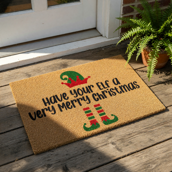 Holiday elf doormat with a festive Christmas welcome mat design featuring a red and green hat and striped elf shoes, perfect for seasonal porch decor and funny winter entryway floor mats for your home during the holiday season.