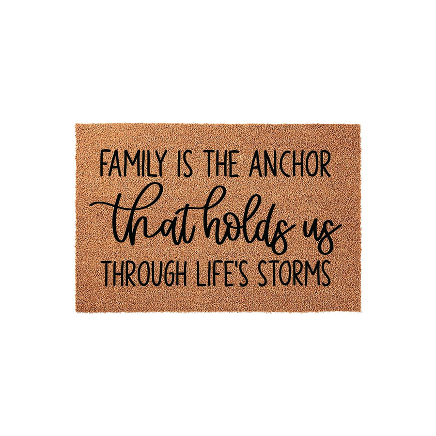 Family Is The Anchor Coir Doormat featuring a natural tan fiber texture and bold black lettering that reads Family Is The Anchor that holds us THROUGH LIFE'S STORMS, creating a welcoming and sentimental entryway decor piece.