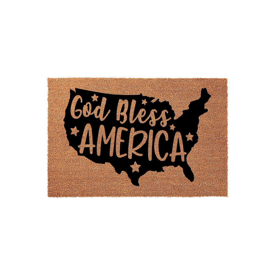 God Bless America coir doormat featuring a black silhouette of the United States map printed on a natural tan fiber background, accented with decorative stars and patriotic typography for a welcoming front porch entrance decor