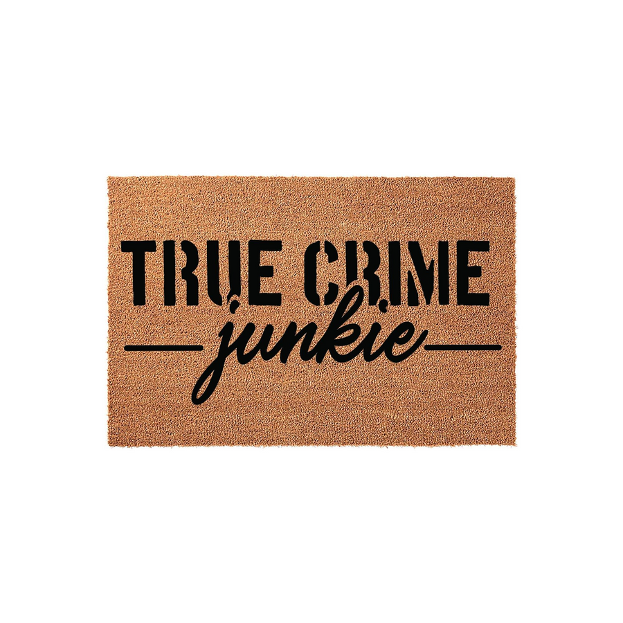 True Crime Junkie coir doormat featuring bold black text on a natural brown fiber background, designed for a front porch entrance to show off a fun personality and welcome guests with a humorous, mystery-loving home decor style.