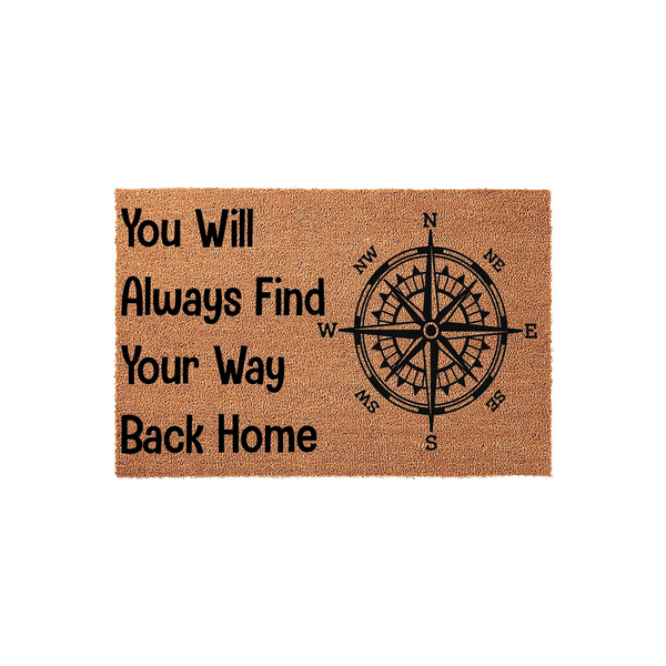 Compass Rose Welcome Doormat featuring the phrase You Will Always Find Your Way Back Home in bold black lettering on a natural tan coir fiber background, creating a nautical and adventurous aesthetic for your front porch entryway.
