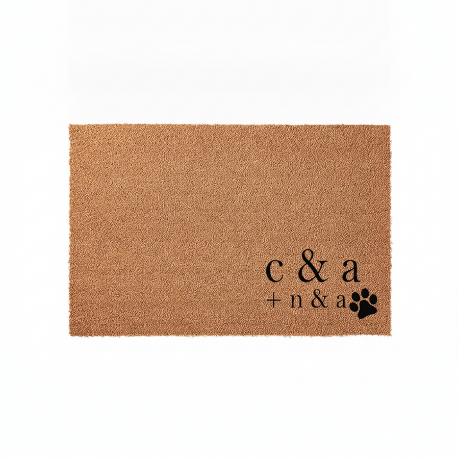 Personalized coir doormat featuring custom initials and a black paw print design, displayed on a clean white background to highlight the natural tan texture of the durable outdoor welcome mat for pet-loving families and new