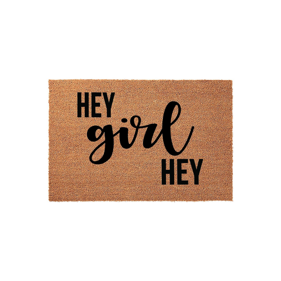Hey Girl Hey coir doormat featuring a natural tan fiber texture and bold black typography, designed as a fun and welcoming front porch entrance mat for your home that adds a playful touch to any entryway decor style.