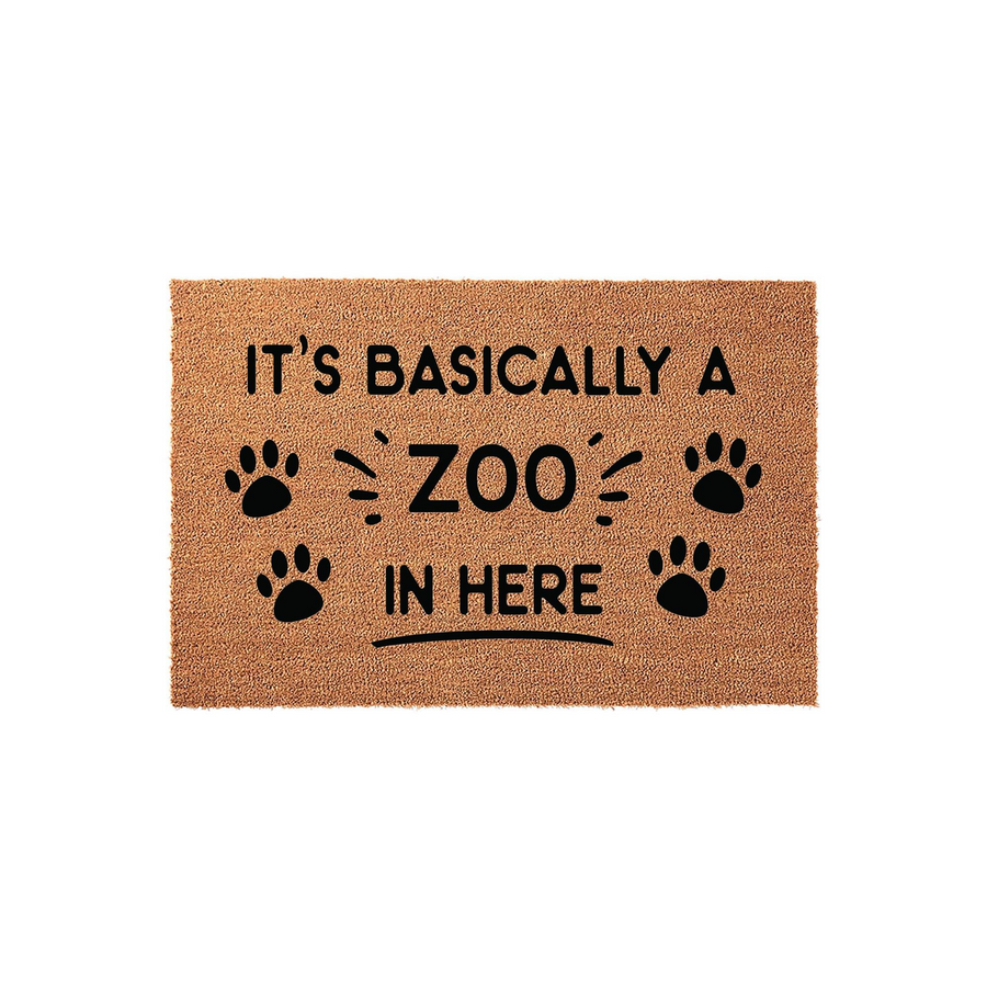It's Basically a Zoo in Here coir doormat featuring bold black text and playful paw print accents on a natural brown fiber background, making a humorous entryway rug for pet lovers who have a house full of furry friends and