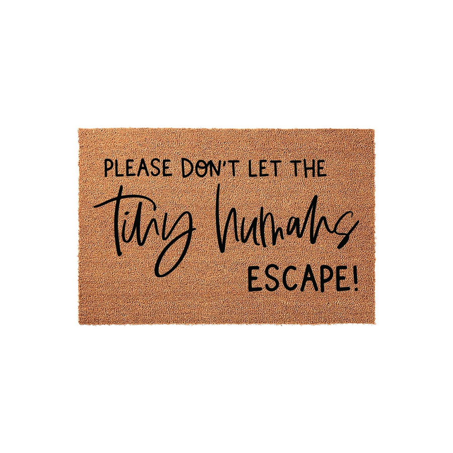 Funny Tiny Humans Escape doormat made of natural coir fiber with a textured brown surface, featuring bold black text that reads Please Don't Let The Tiny Humans Escape in a mix of modern sans-serif and elegant script fonts.