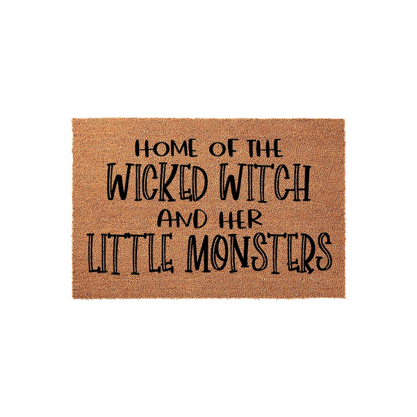 Wicked Witch Halloween Doormat featuring natural coir fibers and bold black text that reads Home of the Wicked Witch and her Little Monsters, creating a fun and spooky entryway decoration for the fall season on a plain white