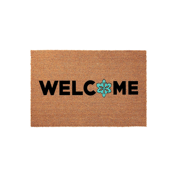 Welcome coir doormat with a rustic brown natural fiber texture, featuring bold black lettering and a bright turquoise snowflake icon replacing the letter O to create a festive winter entryway decor piece for your front porch.