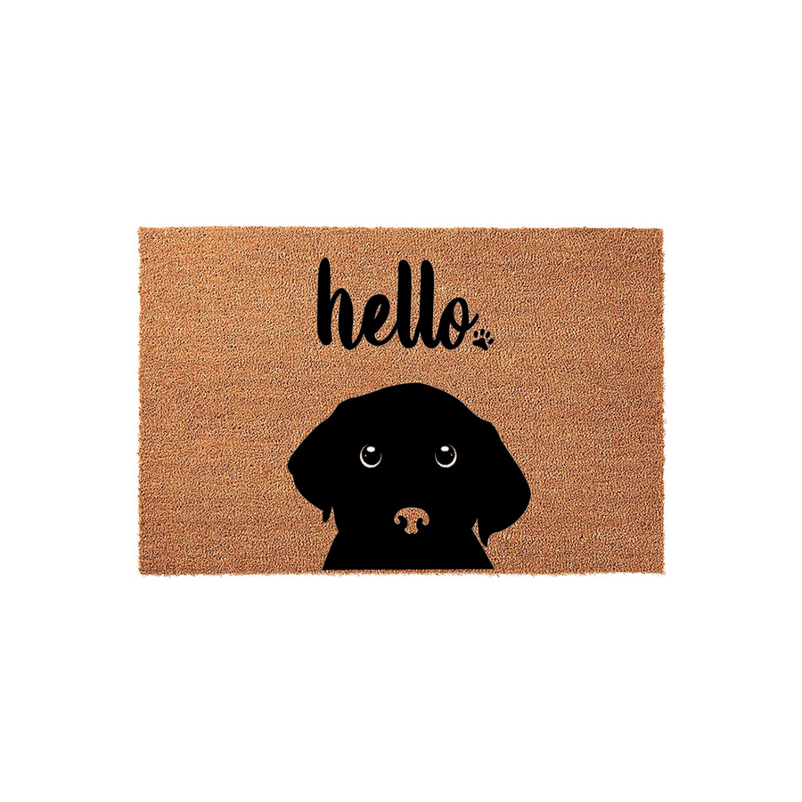 Black Labrador Retriever doormat featuring a natural coir texture and a black silhouette of a puppy face, with the word hello printed in a playful script font above the dog illustration on a plain white background.