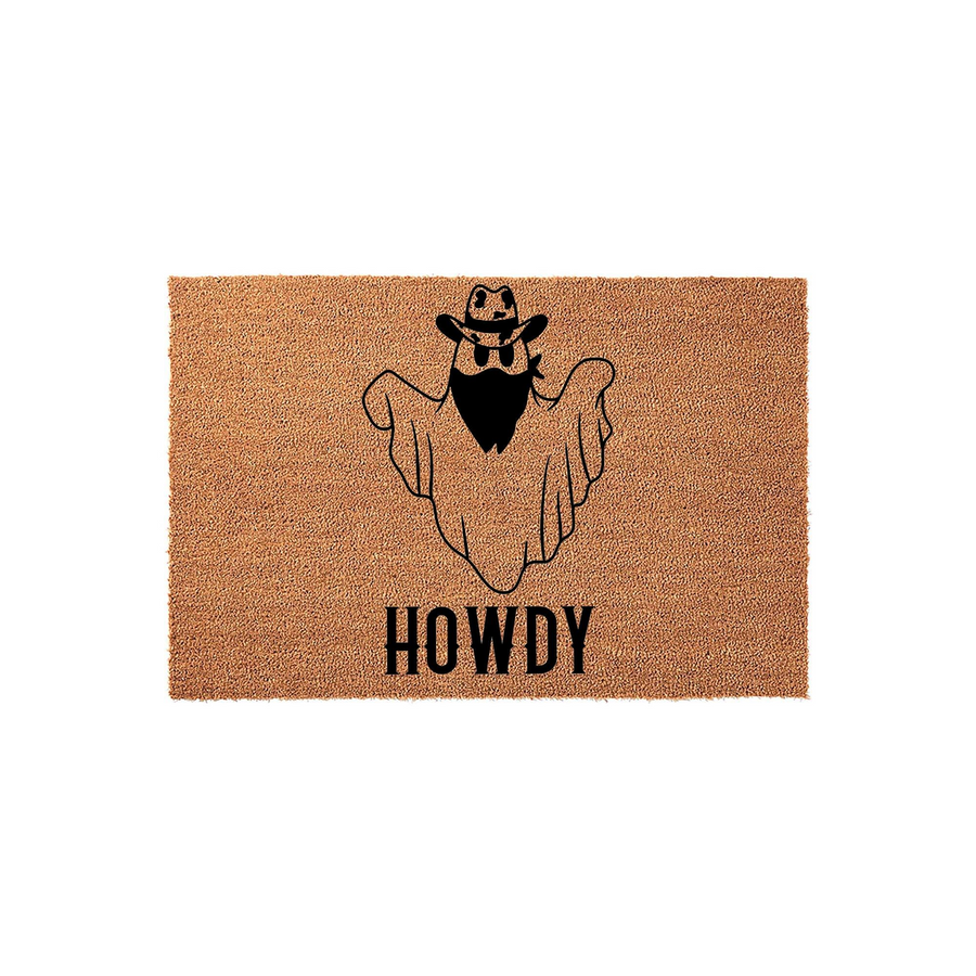 Cowboy Ghost Howdy Doormat featuring a natural coir texture with a black graphic of a spooky ghost wearing a western cowboy hat and bandana, centered above the word Howdy in a bold, rustic font for a fun seasonal front porch