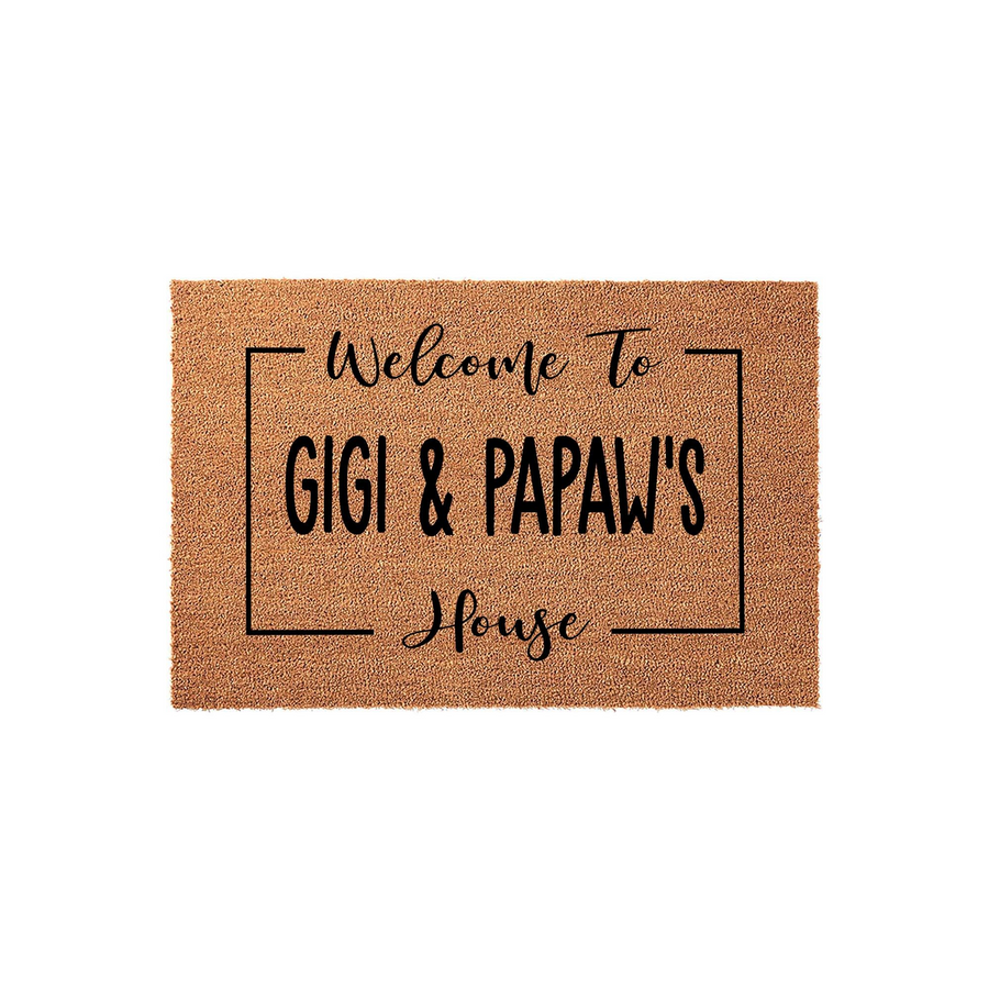 Personalized Gigi and Papaw coir doormat featuring a natural brown fiber texture and black printed text that reads Welcome To Gigi and Papaw's House, framed by a simple rectangular border on a clean white studio background.