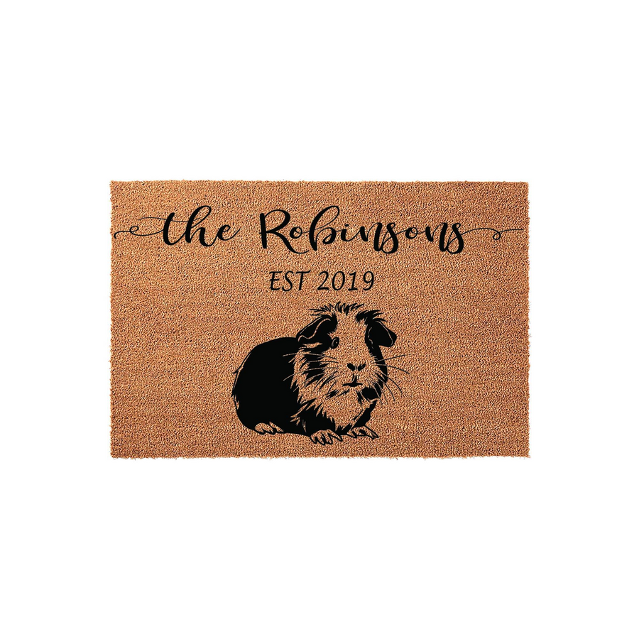 Personalized Guinea Pig Coir Doormat featuring a black and brown illustration of a guinea pig, with custom family name text and an established year printed in black ink on a natural tan textured coir fiber background for a home