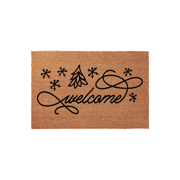 Winter Welcome Coir Doormat featuring a festive black script font, a stylized evergreen tree, and several snowflake icons printed on a natural brown fiber background for a cozy holiday entryway decor aesthetic.