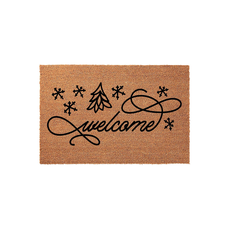 Winter Welcome Coir Doormat featuring a festive black script font, a stylized evergreen tree, and several snowflake icons printed on a natural brown fiber background for a cozy holiday entryway decor aesthetic.
