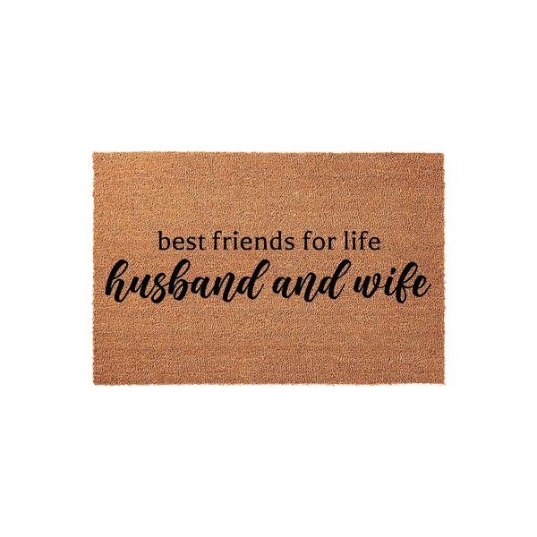 Husband and wife best friends for life doormat featuring natural coir fibers and bold black lettering, providing a welcoming and durable entrance decor piece for a newlywed couple or a long-term home entryway on a plain white