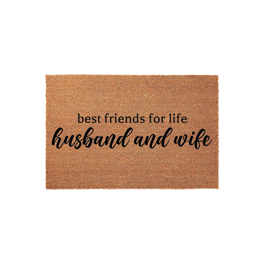 Husband and wife best friends for life doormat featuring natural coir fibers and bold black lettering, providing a welcoming and durable entrance decor piece for a newlywed couple or a long-term home entryway on a plain white