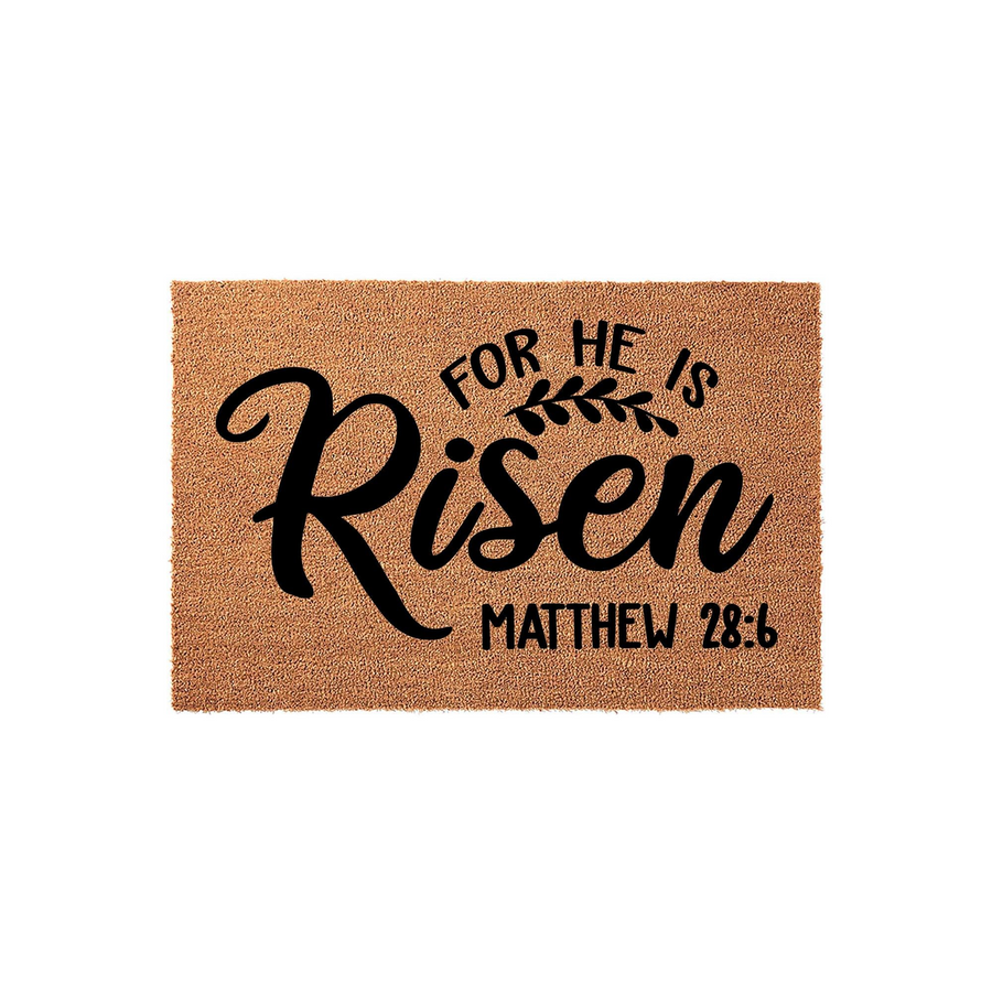 For He Is Risen Matthew 28:6 coir doormat featuring elegant black script lettering on a natural brown fiber background, creating a welcoming religious entryway decor piece for your front porch during the Easter holiday season.